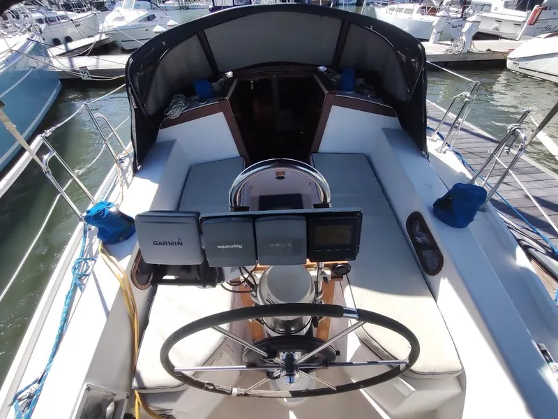 Slide: The Image of Cockpit of 1990 Catalina C-34 sailboat with navigation equipment and steering wheel. - 16