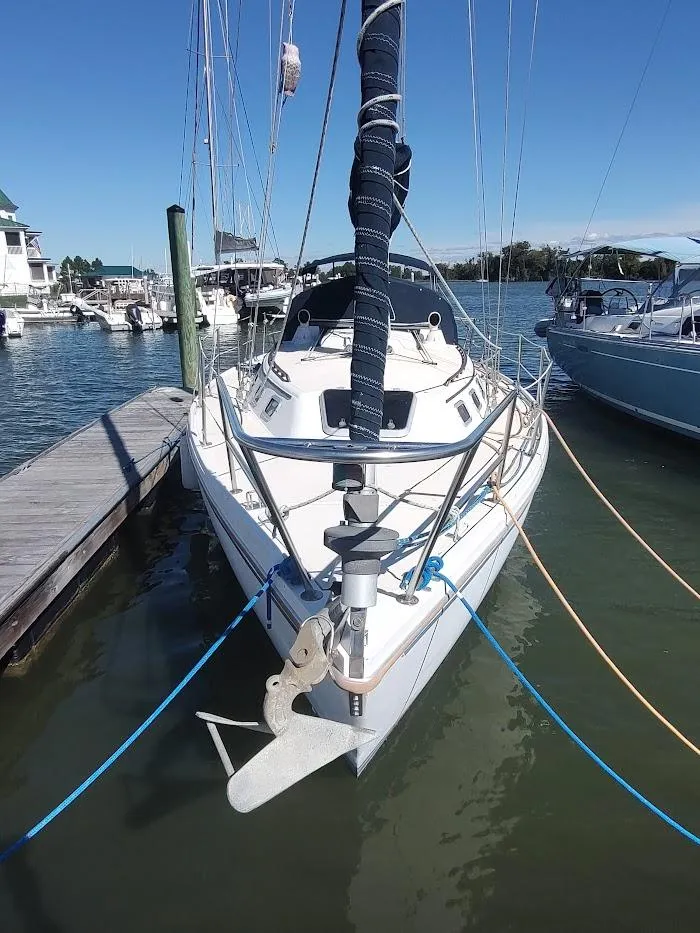 Slide: The Image of 1990 Catalina C-34 sailboat docked at marina on a sunny day. - 2