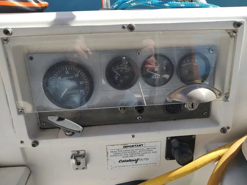 Slide: The Image of Control panel of a 1990 Catalina C-34 sailboat with gauges and switches. - 20