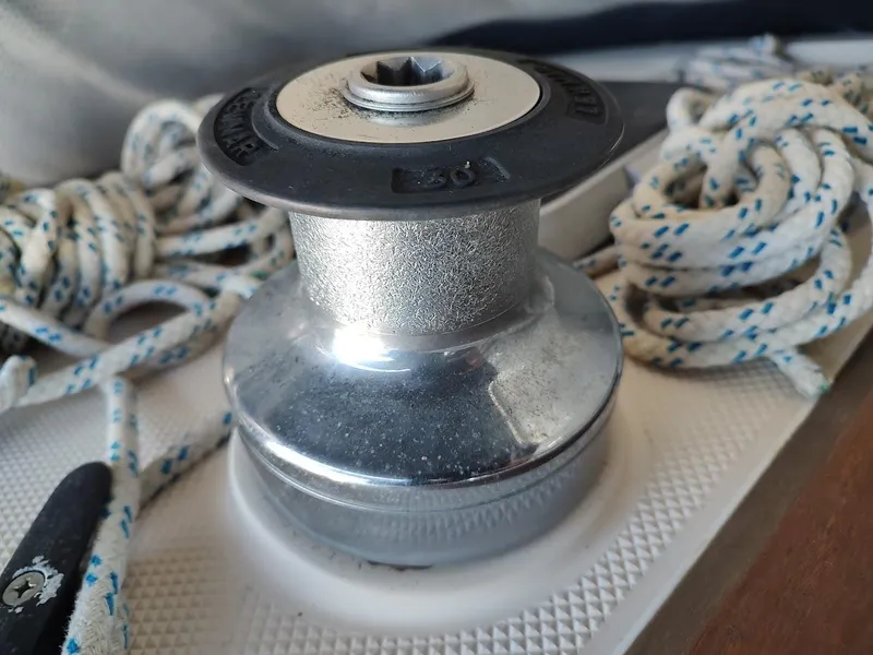 Slide: The Image of Winch on a 1990 Catalina C-34 sailboat with coiled ropes. - 27