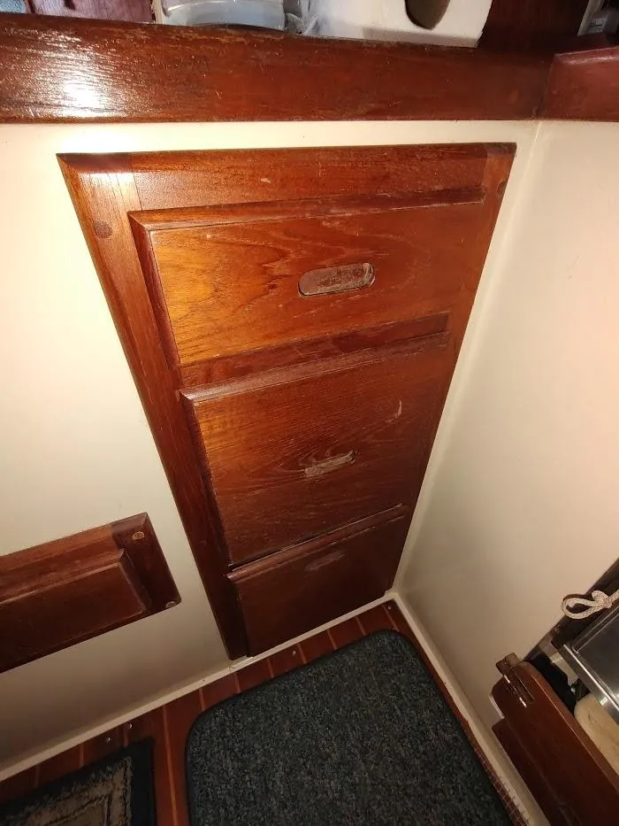 Slide: The Image of Wooden cabinet inside a 1990 Catalina C-34 sailboat interior. - 43