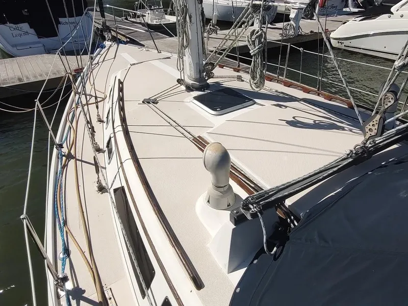 Slide: The Image of 1990 Catalina C-34 sailboat deck with rigging and docked at marina. - 6