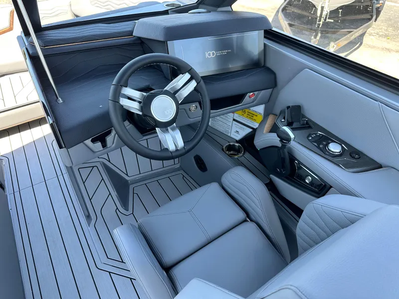 Slide: The Image of 2025 Nautique Super Air Nautique G23 cockpit with modern steering and controls. - 10