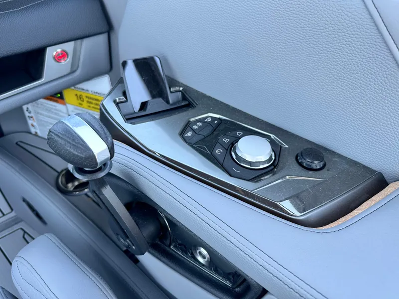 Slide: The Image of Control panel of 2025 Nautique Super Air Nautique G23 boat, featuring sleek design and modern controls. - 12