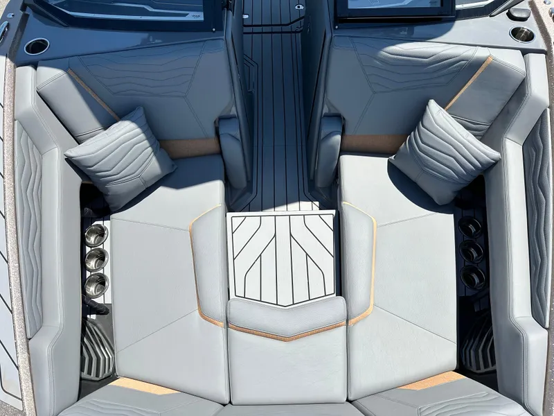 Slide: The Image of 2025 Nautique Super Air Nautique G23 interior with luxurious seating and modern design. - 15