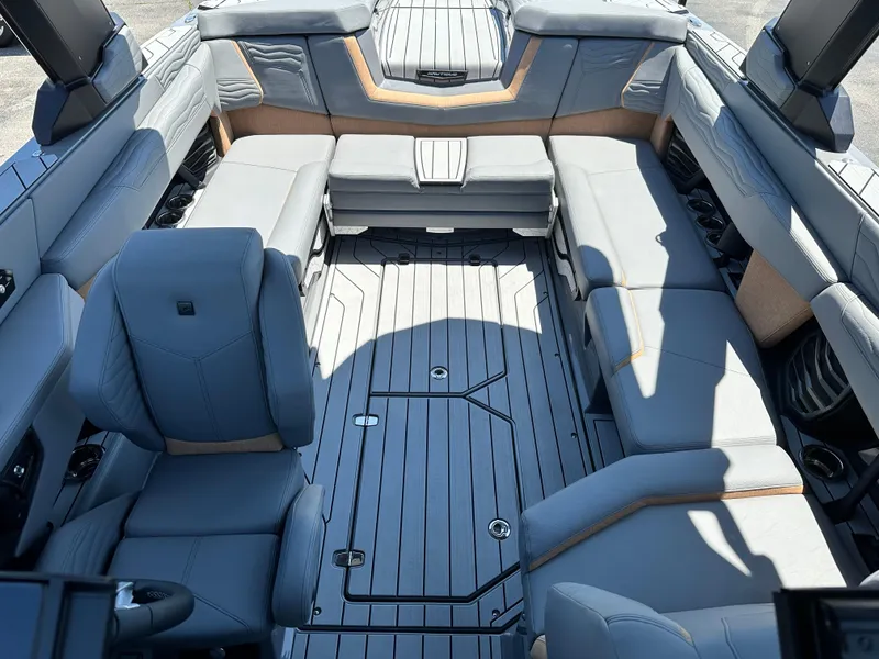 Slide: The Image of Luxurious interior of 2025 Nautique Super Air Nautique G23 boat with spacious seating. - 16