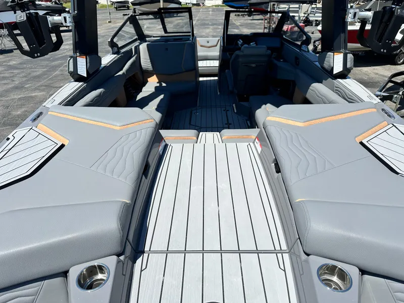 Slide: The Image of 2025 Nautique Super Air Nautique G23 interior with sleek gray seating and modern design. - 7