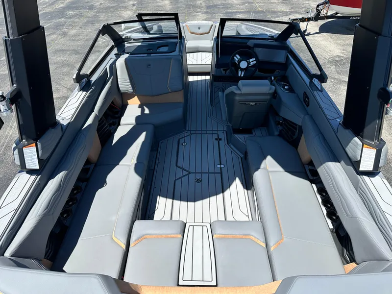 Slide: The Image of 2025 Nautique Super Air Nautique G23 interior with sleek seating and modern dashboard design. - 8