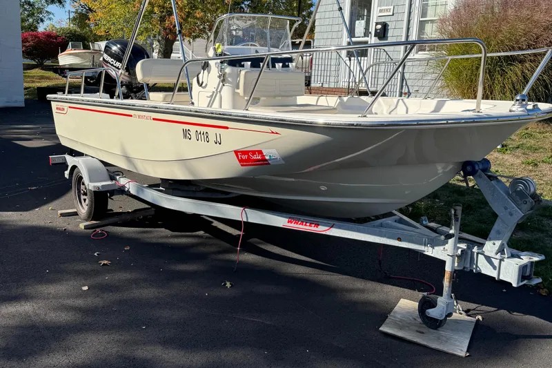 Slide: The Image of 2018 Boston Whaler 170 Montauk boat on trailer, for sale sign visible. - 4