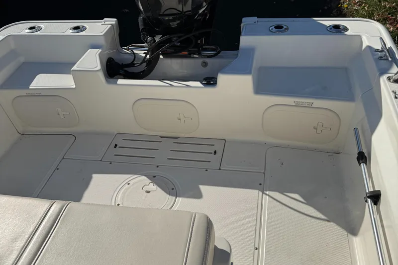 Slide: The Image of 2018 Boston Whaler 170 Montauk boat interior with seating and storage compartments. - 7