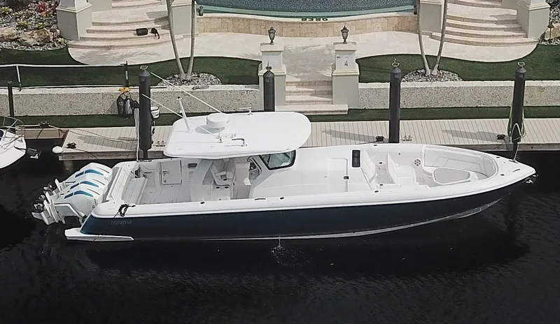 Slide: The Image of 2022 Intrepid 407 Panacea boat docked at a marina. - 0
