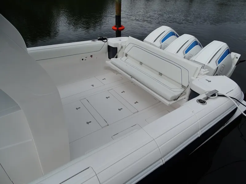 Slide: The Image of 2022 Intrepid 407 Panacea boat with triple outboard engines and spacious deck. - 11