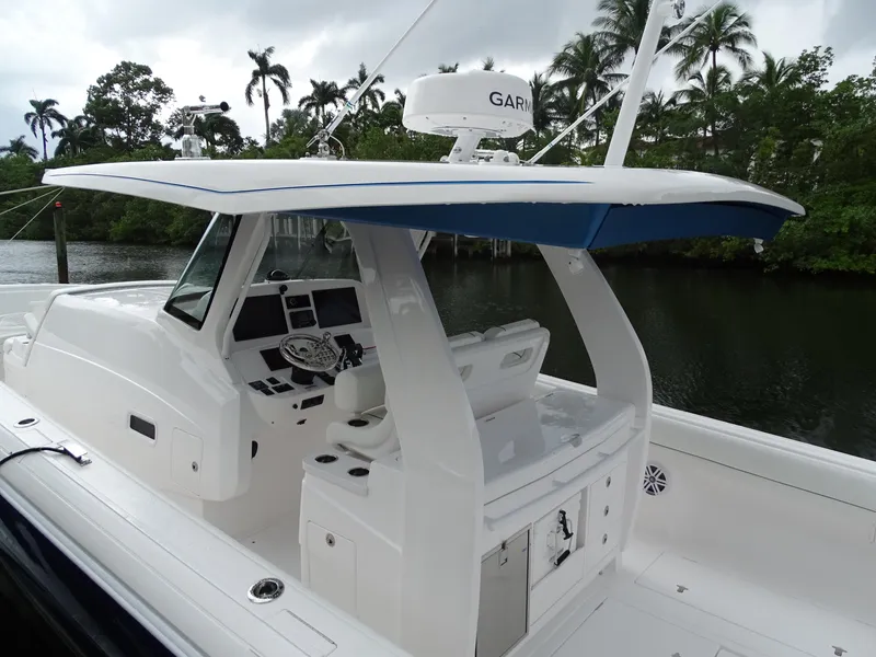 Slide: The Image of 2022 Intrepid 407 Panacea boat with sleek design and advanced navigation system. - 12