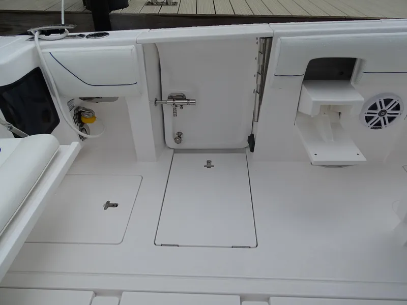 Slide: The Image of 2022 Intrepid 407 Panacea boat deck with storage compartments and seating area. - 19