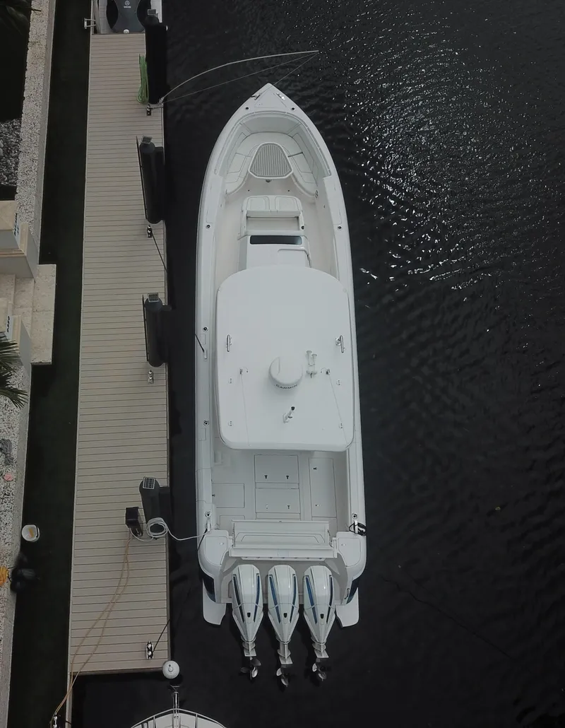 Slide: The Image of Aerial view of 2022 Intrepid 407 Panacea yacht docked in marina. - 2