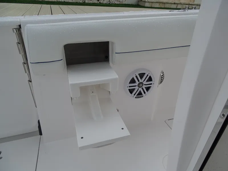 Slide: The Image of 2022 Intrepid 407 Panacea boat interior with speaker and storage compartment. - 20