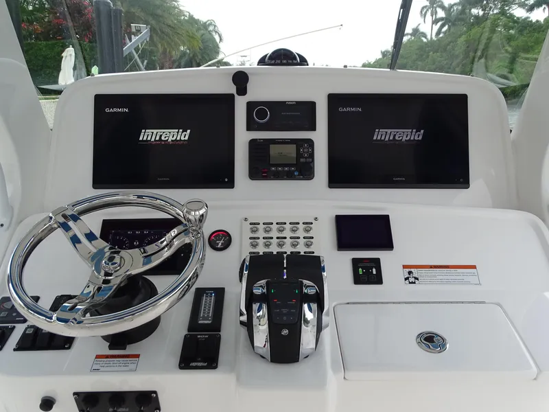 Slide: The Image of 2022 Intrepid 407 Panacea helm with dual Garmin displays and modern controls. - 27