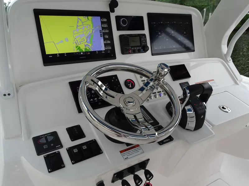 Slide: The Image of Intrepid 407 Panacea 2022 helm with navigation screens and controls. - 28