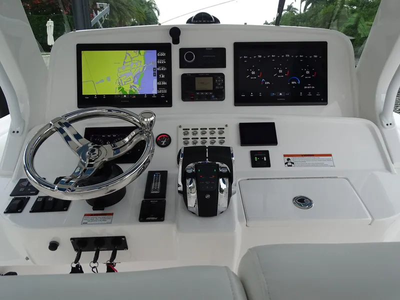 Slide: The Image of 2022 Intrepid 407 Panacea helm with navigation screens and controls. - 29