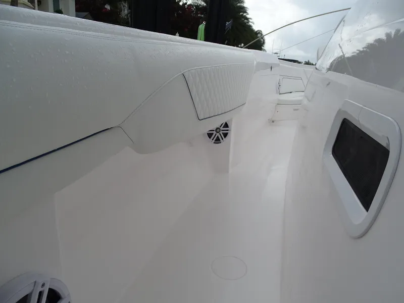 Slide: The Image of 2022 Intrepid 407 Panacea boat interior with sleek white design and modern features. - 30