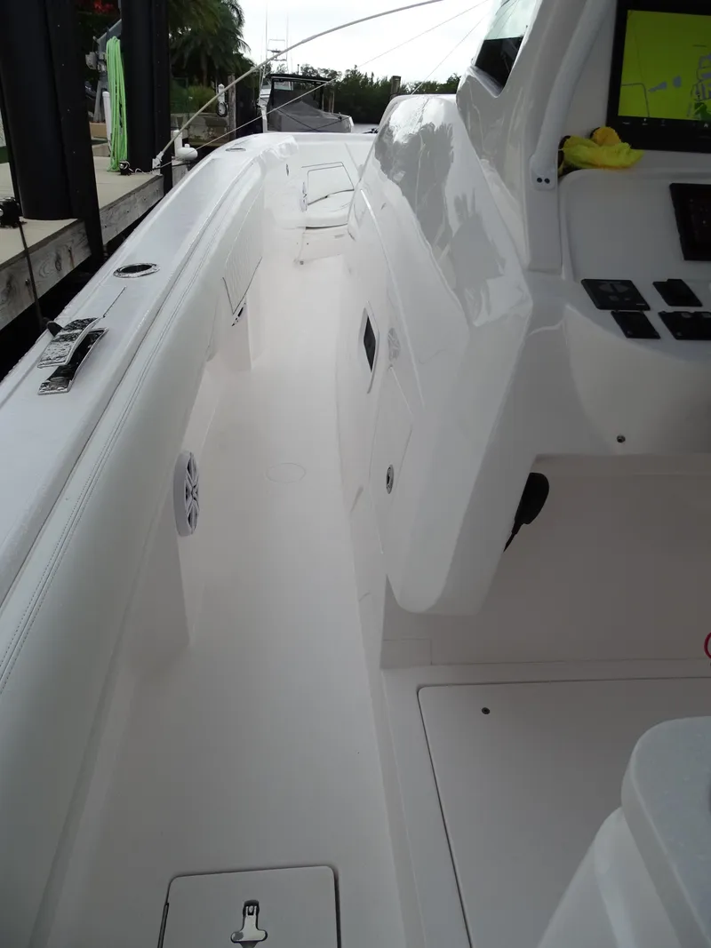 Slide: The Image of 2022 Intrepid 407 Panacea boat interior with sleek white design and modern controls. - 31