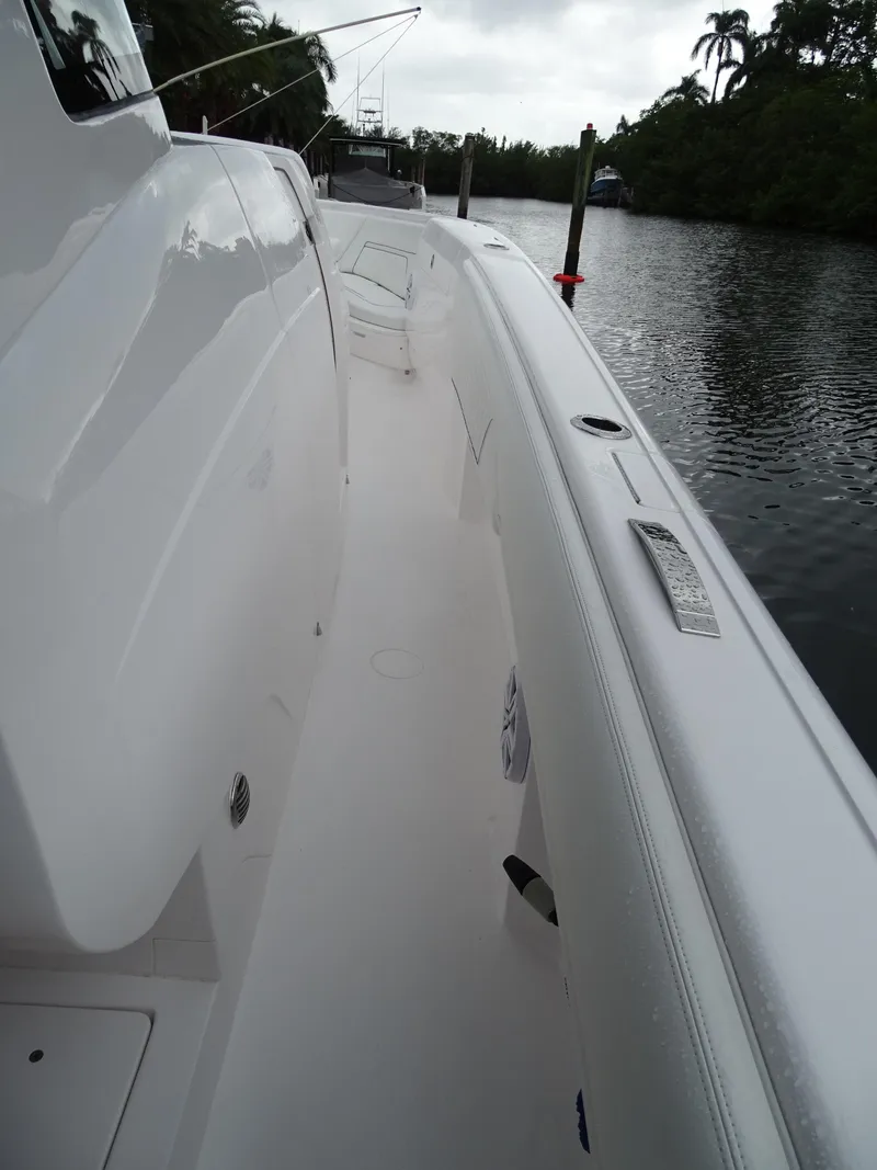 Slide: The Image of 2022 Intrepid 407 Panacea boat docked on a calm river. - 32