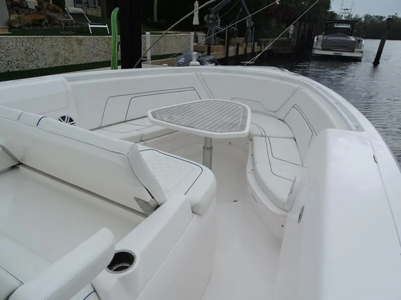 Slide: The Image of 2022 Intrepid 407 Panacea boat with spacious seating and table on deck. - 35