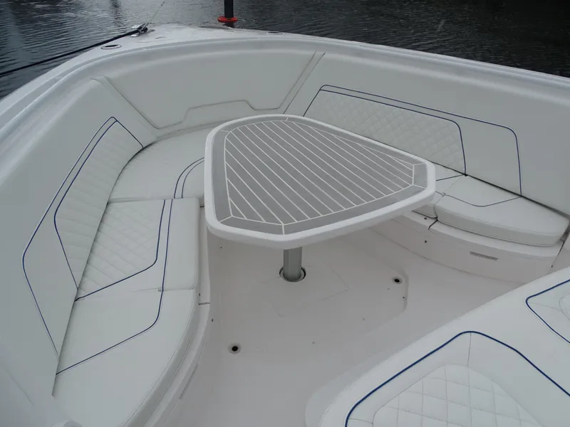 Slide: The Image of Luxurious seating area on 2022 Intrepid 407 Panacea boat with sleek table design. - 36