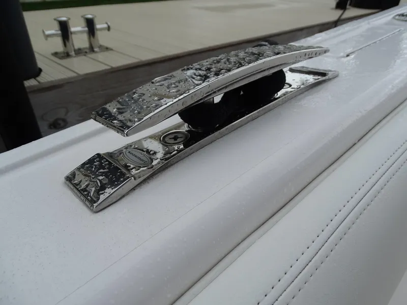 Slide: The Image of Close-up of a 2022 Intrepid 407 Panacea boat cleat with water droplets. - 41
