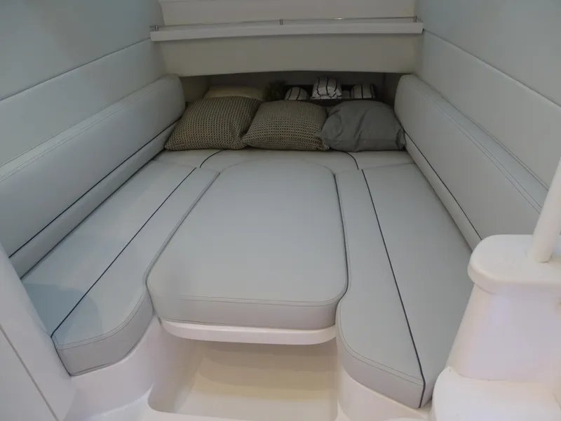 Slide: The Image of 2022 Intrepid 407 Panacea cabin interior with cushioned seating and pillows. - 43