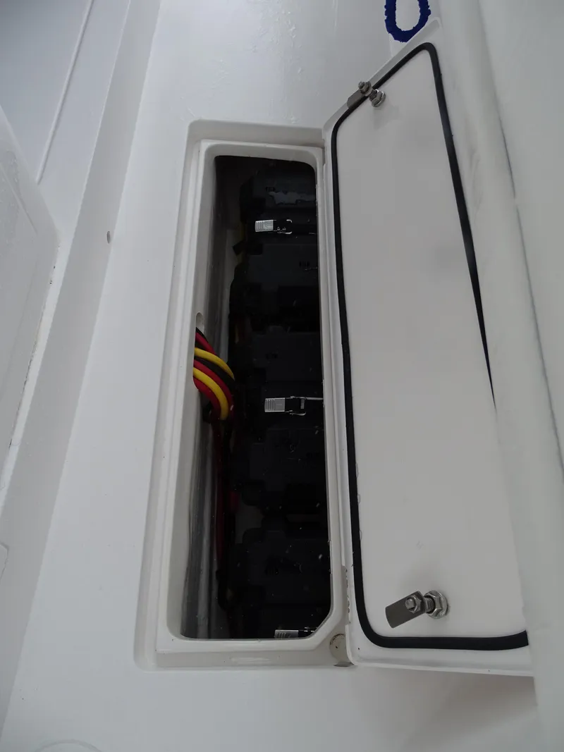 Slide: The Image of 2022 Intrepid 407 Panacea electrical panel with open access hatch. - 49