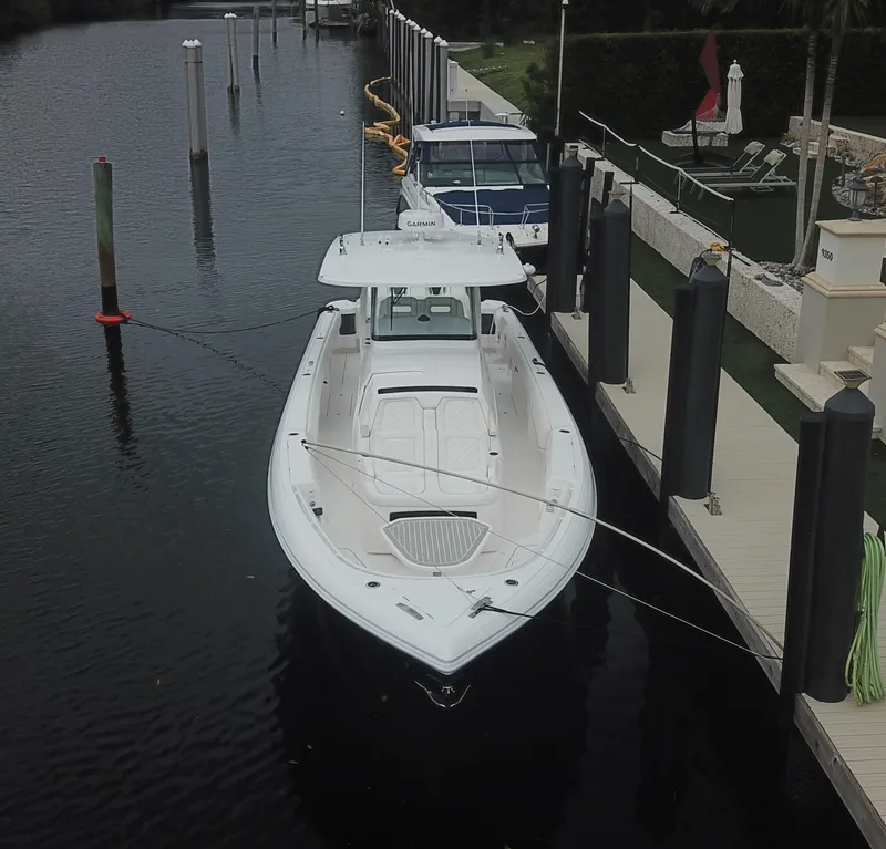 Slide: The Image of 2022 Intrepid 407 Panacea boat docked in a marina. - 7