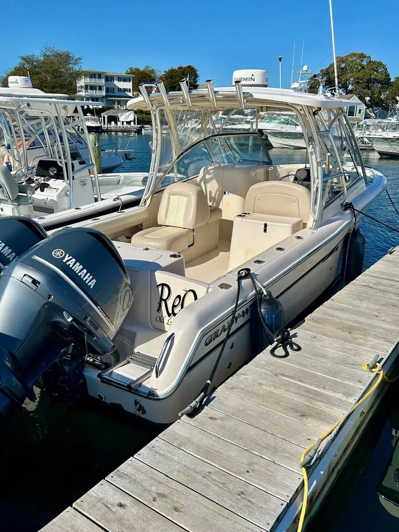 Slide: The Image of 2012 Grady-White Freedom 285 boat docked with Yamaha engines. - 3