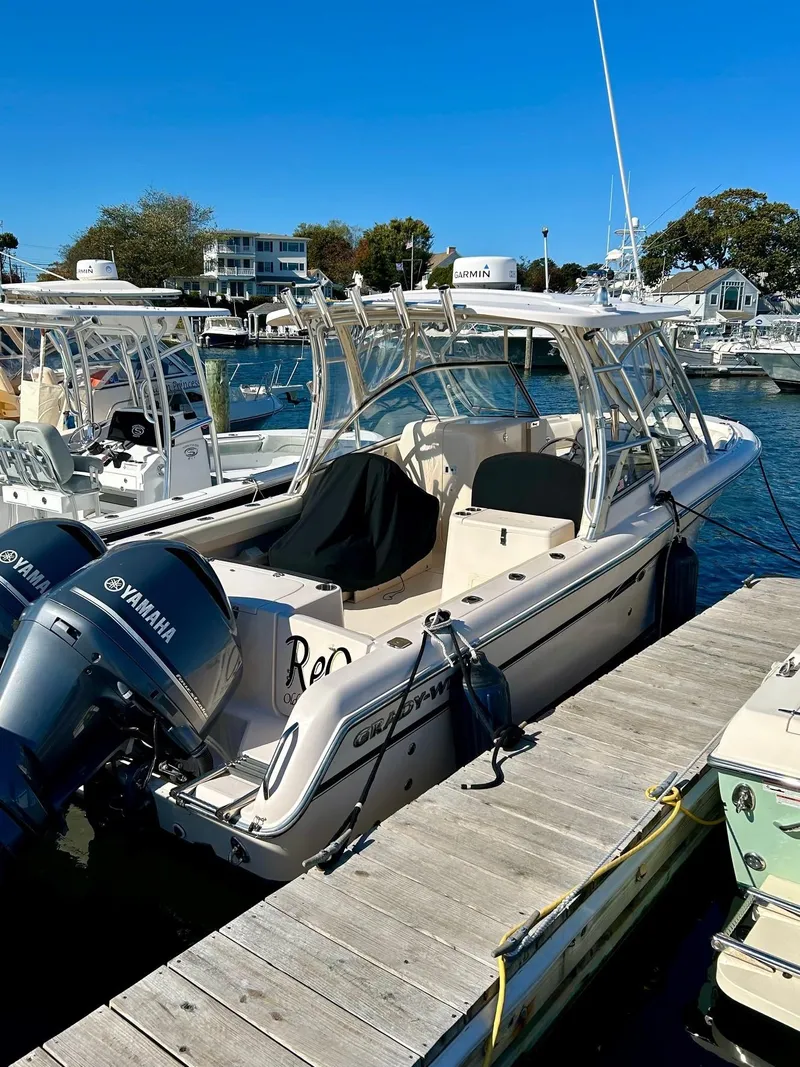 Slide: The Image of 2012 Grady-White Freedom 285 boat docked with Yamaha engines. - 7