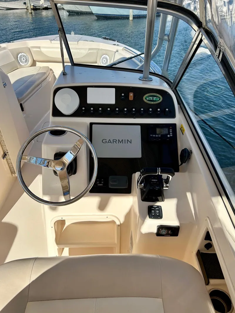 Slide: The Image of 2012 Grady-White Freedom 285 boat cockpit with Garmin navigation system. - 8