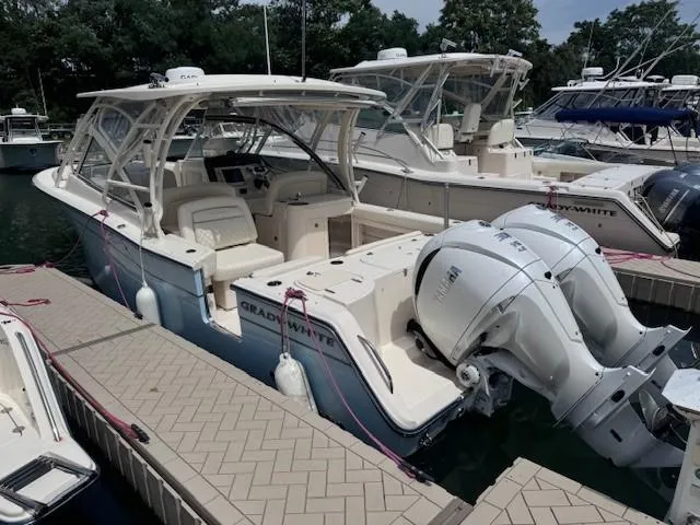 The Image of 2023 Grady-White Freedom 307 boat docked with twin engines. - 0