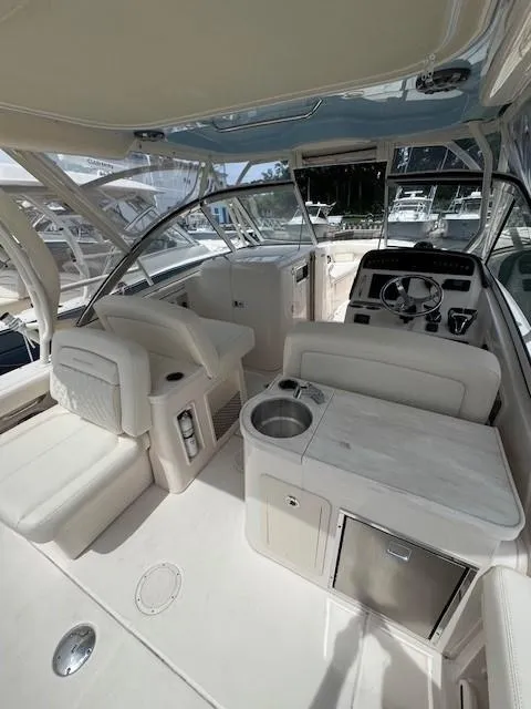 Slide: The Image of 2023 Grady-White Freedom 307 boat interior with seating and helm. - 3