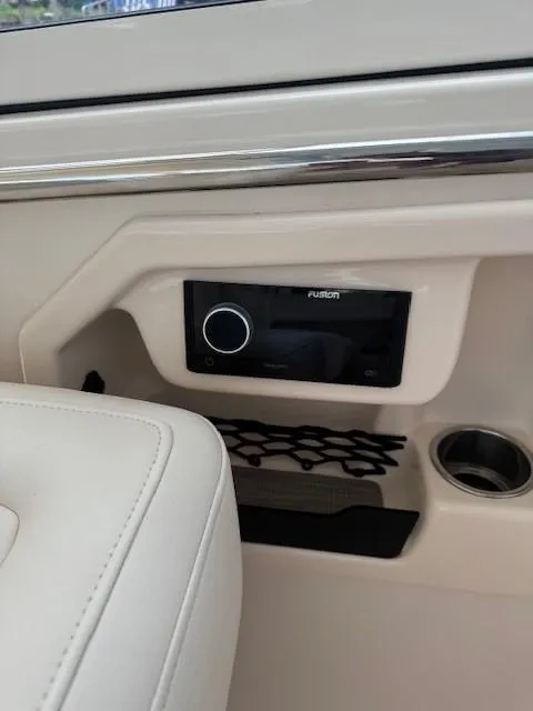 Slide: The Image of 2023 Grady-White Freedom 307 boat interior with Fusion stereo system. - 4