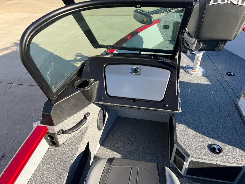 Slide: The Image of 2025 Lund 1775 Adventure Sport boat interior with seating and windshield. - 15