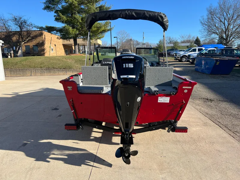 Slide: The Image of 2025 Lund 1775 Adventure Sport boat with Mercury 115 engine, parked outdoors. - 5