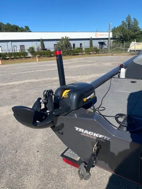 Slide: The Image of 2014 Bass Tracker PRO TEAM 190 boat with motor in parking lot. - 10