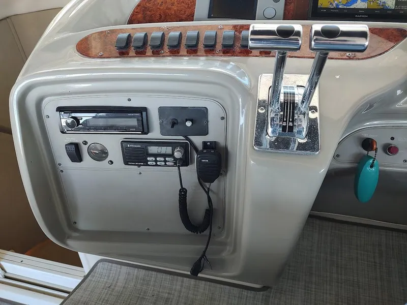 Slide: The Image of Control panel of a 1999 Maxum 4100 SCR boat with navigation and communication equipment. - 15