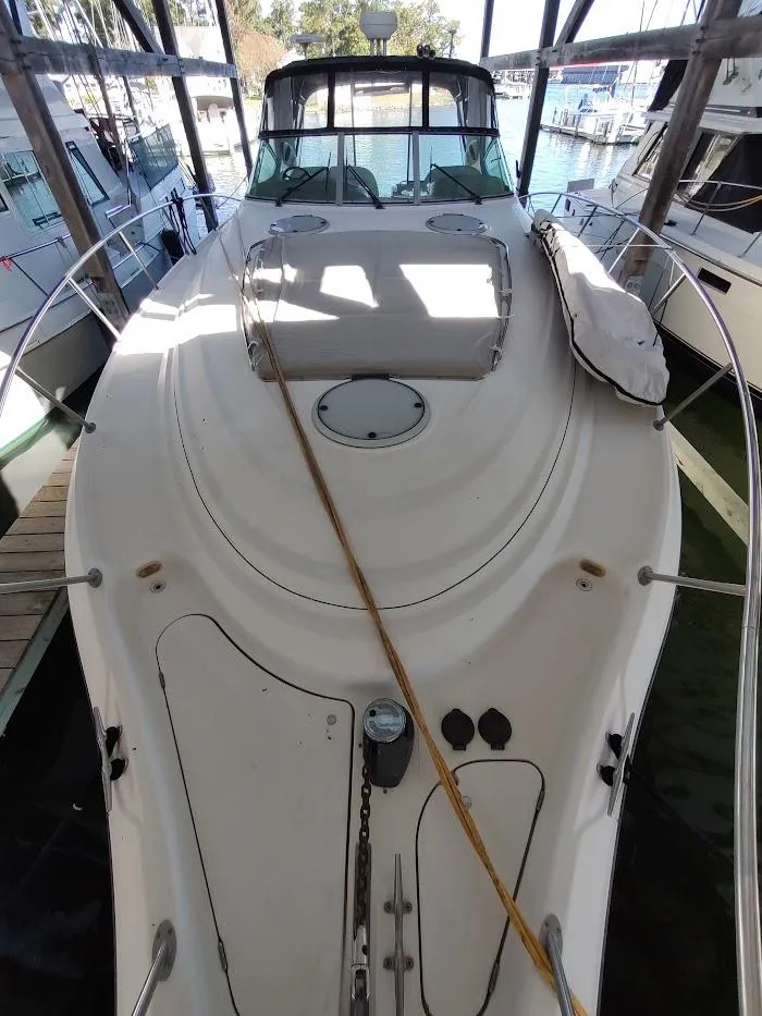 Slide: The Image of 1999 Maxum 4100 SCR yacht docked in marina, top view of deck and cabin. - 23