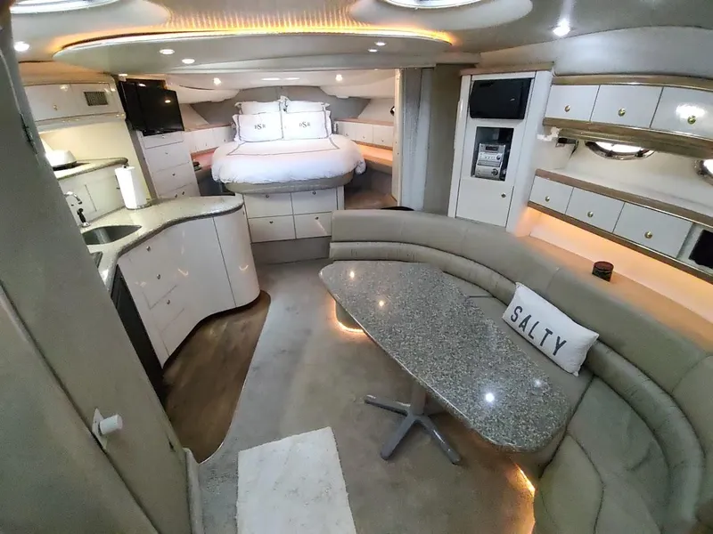 Slide: The Image of Luxurious interior of 1999 Maxum 4100 SCR yacht with modern amenities and elegant design. - 26