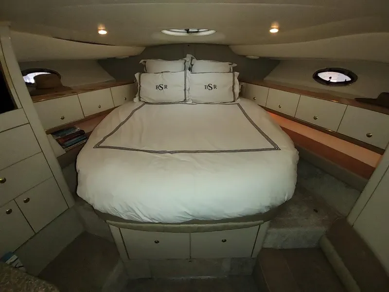 Slide: The Image of Luxurious cabin interior of 1999 Maxum 4100 SCR yacht with cozy bed and elegant lighting. - 37