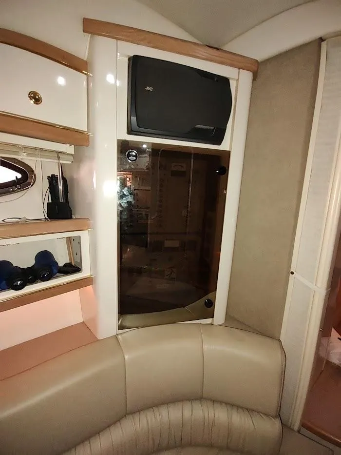 Slide: The Image of Interior of 1999 Maxum 4100 SCR yacht with seating and storage. - 45