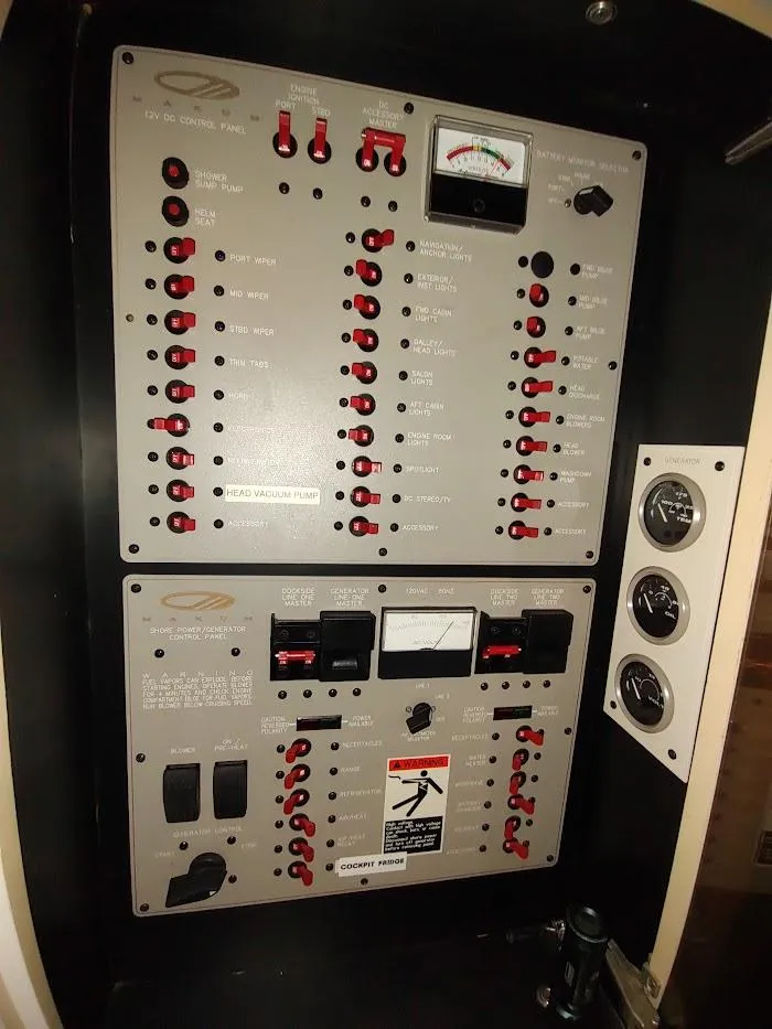 Slide: The Image of Control panel of a 1999 Maxum 4100 SCR boat with switches and gauges. - 46