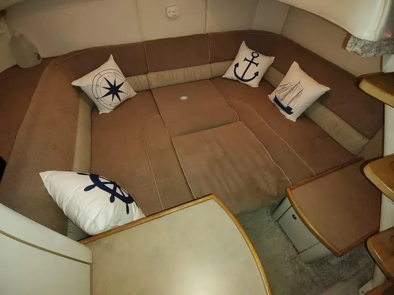 Slide: The Image of Interior of 1999 Maxum 4100 SCR boat with nautical-themed cushions. - 49