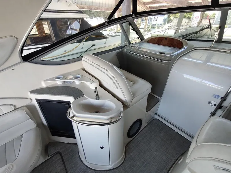 Slide: The Image of Interior of 1999 Maxum 4100 SCR yacht with seating and sink area. - 9