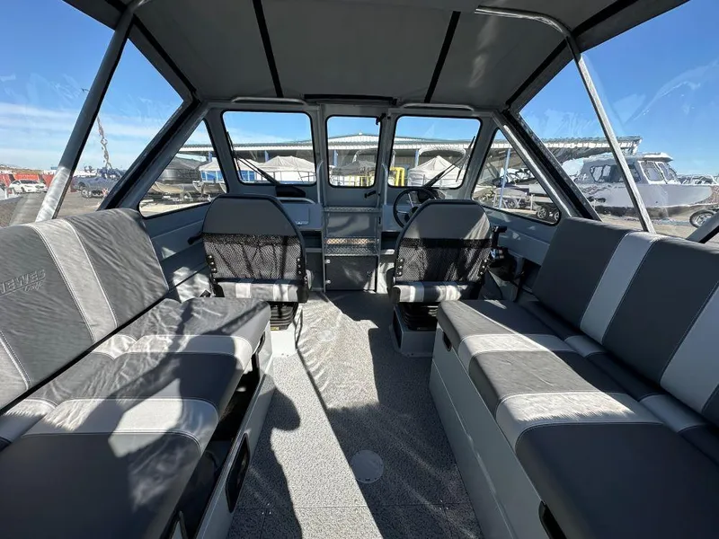 Slide: The Image of Interior of 2025 Hewescraft 200 ProV ET boat with spacious seating and modern design. - 5